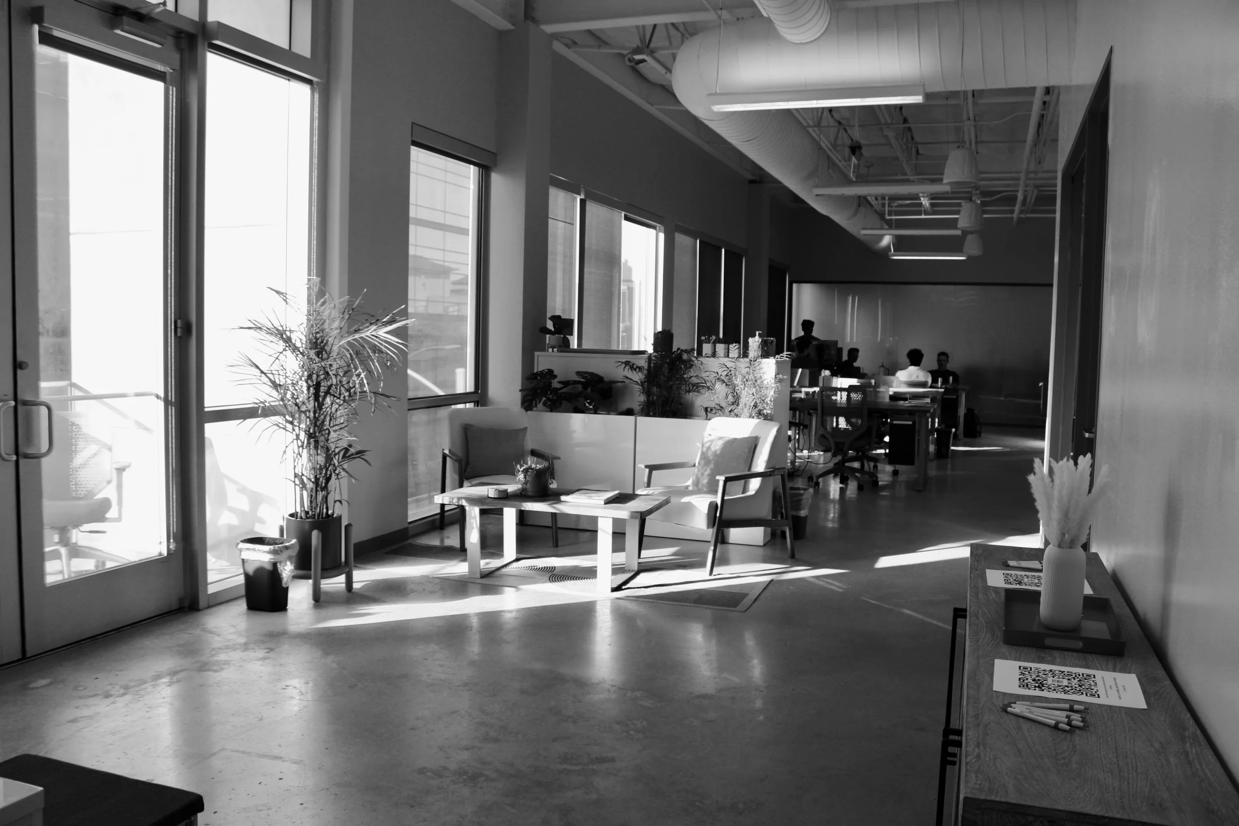 Historical view of the Foundry space, with lounge seating and desks beside the windows